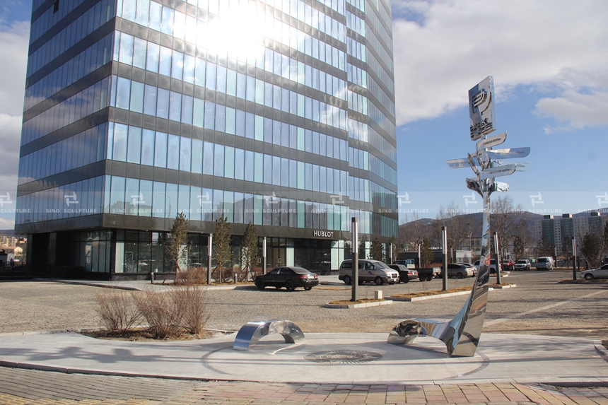 After Installation-mirror-polished-stainless-steel-signage-sculpture-mirror-steel-city-guide-sculpture.jpg